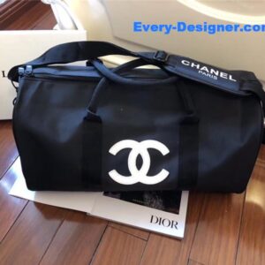Chanel logo luggage bag